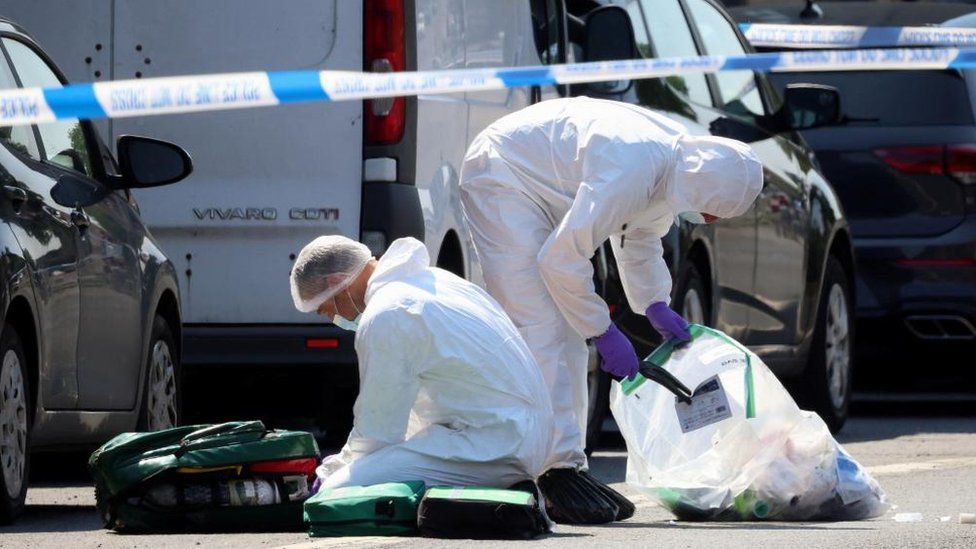 Police forensic scientists gather evidence in Nottingham