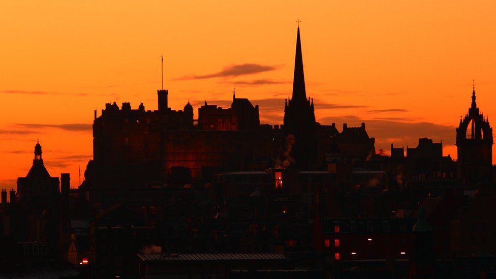 The skyline of Edinburgh against an evening sky