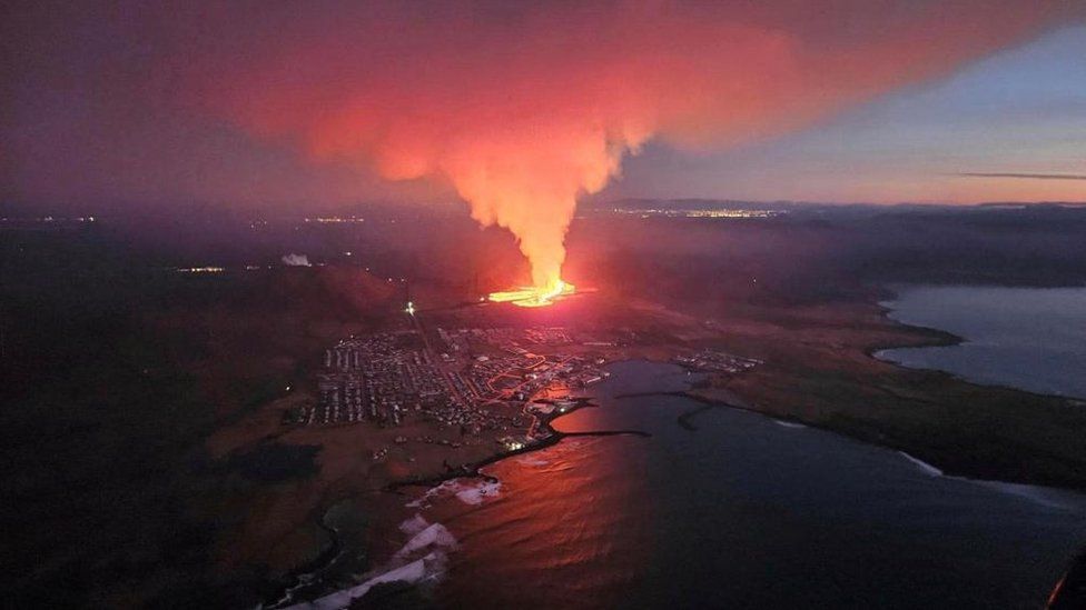 A volcano spews lava and smoke as it erupts in Reykjanes Peninsula