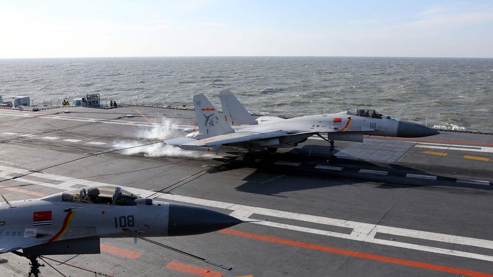 Chinese J-15 fighter jet landing on the deck of the Liaoning aircraft carrier during military drills in the Bohai Sea, off China's northeast coast.