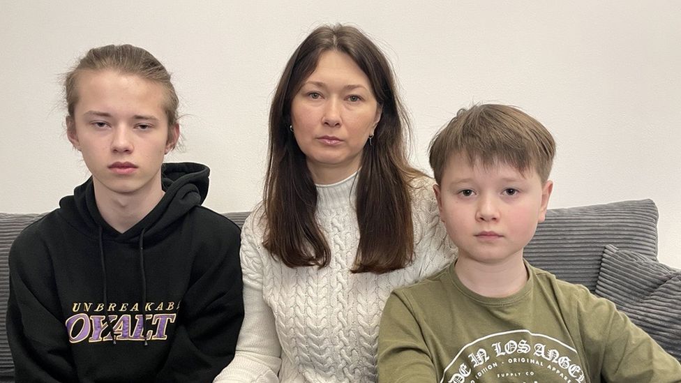 Marta Sobolyuk with her sons Markyin and Danylo Senyk