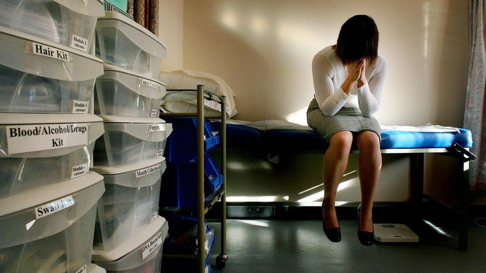 Woman rape victim in medical examination room in rape clinic