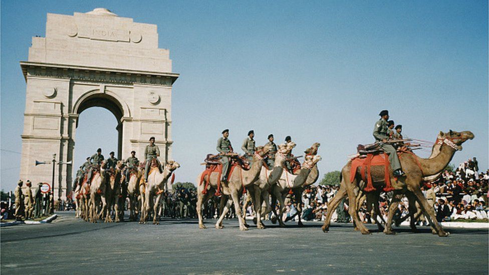 A military parade past India Gate on the Rajpath in Delhi, India, possibly the Delhi Republic Day parade, circa 1965.