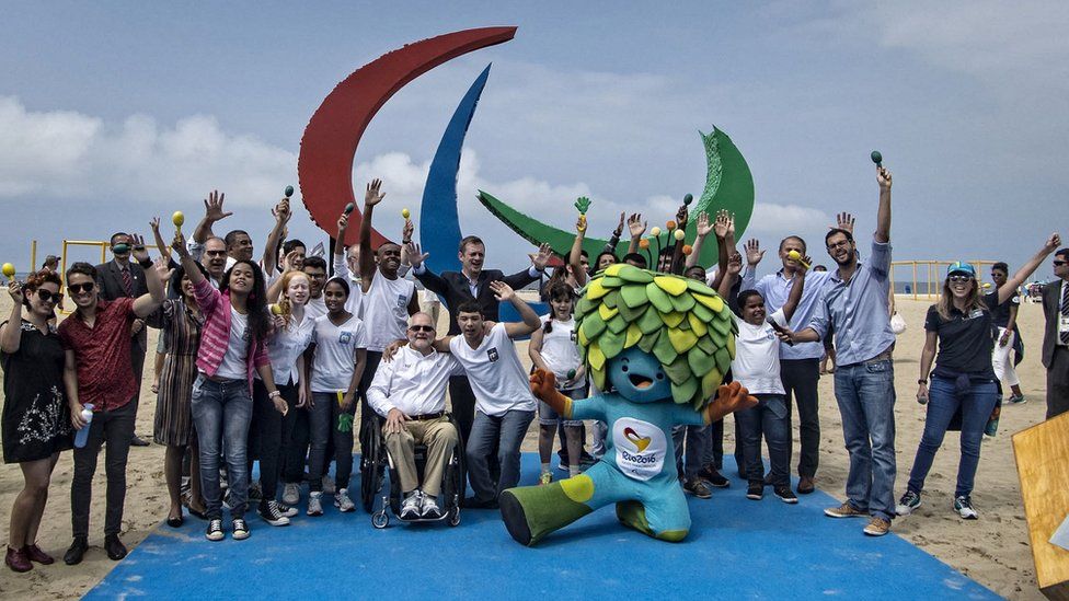 Brazilian Paralympians pose with the mascot of the Games in Rio