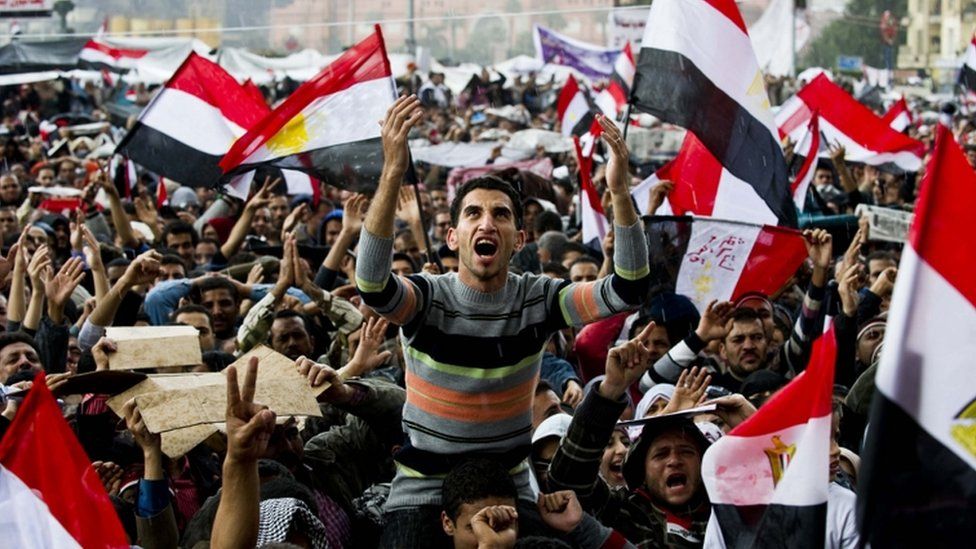Egyptian anti-government demonstrators shout slogans against President Hosni Mubarak at Cairo's Tahrir Square on February 10, 2011