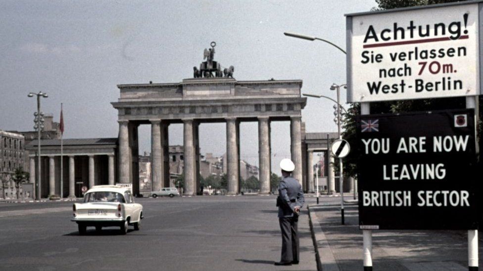 A sign reading "You are now leaving the British Sector" in Berlin