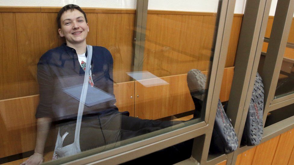 Former Ukrainian army pilot Nadiya Savchenko smiles from a glass-walled cage during a verdict hearing at a court in the southern border town of Donetsk in the Rostov region, Russia, 22 March 2016