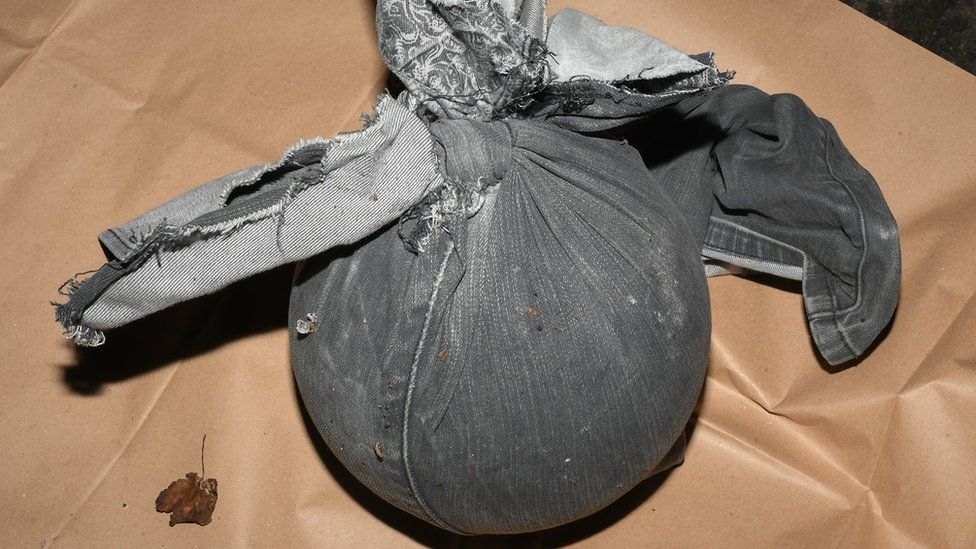 Bowling ball wrapped in jeans