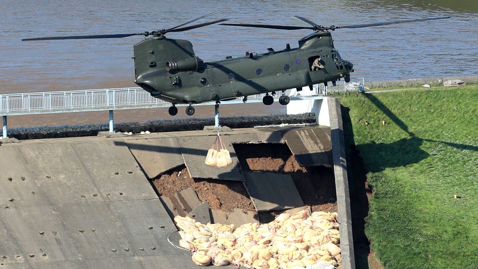 Helicopter laying sandbags