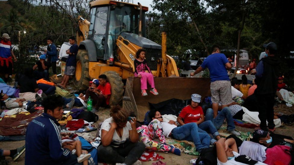 Hondurans taking part in a new caravan of migrants set to head to the United States, take a break in Vado Hondo, Guatemala