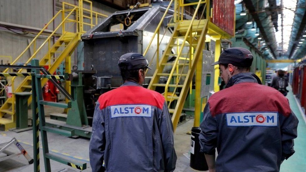 Employees work at the Alstom high-speed train TGV factory in Belfort, eastern France (file picture)