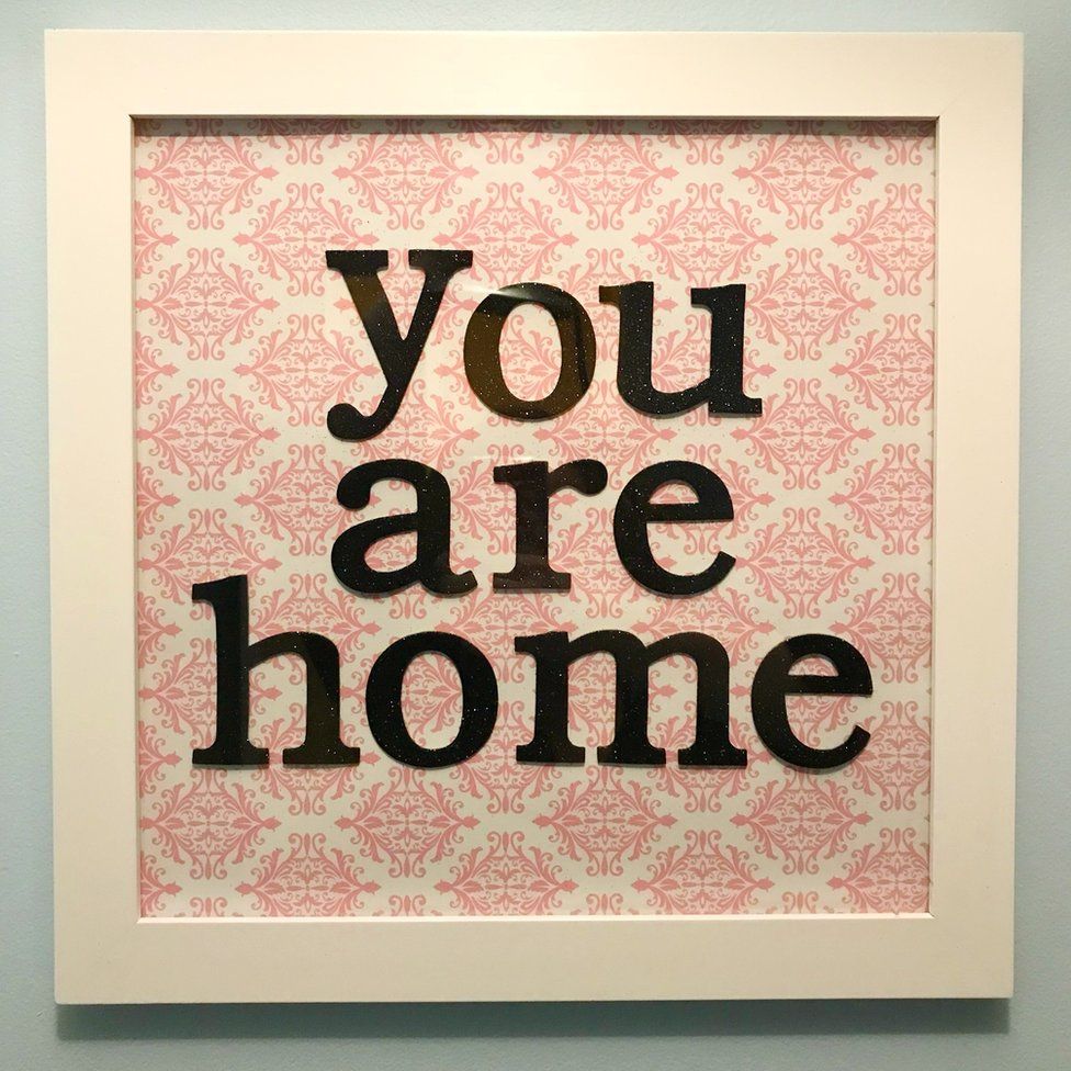 A picture frame with the words "you are home" in it