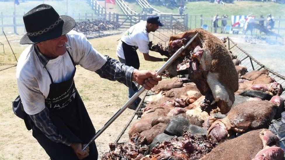 A total of 16,500 kg of beef are grilled in Rodo Park in Minas, Uruguay, 120 km from Montevideo, in an attempt to break the Guinness record for "The World's Biggest Barbecue", on 10 December, 2017