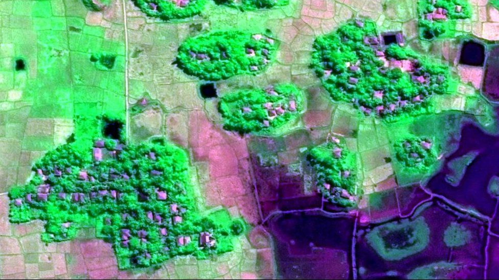 Satellite image showing clusters of structures in a village