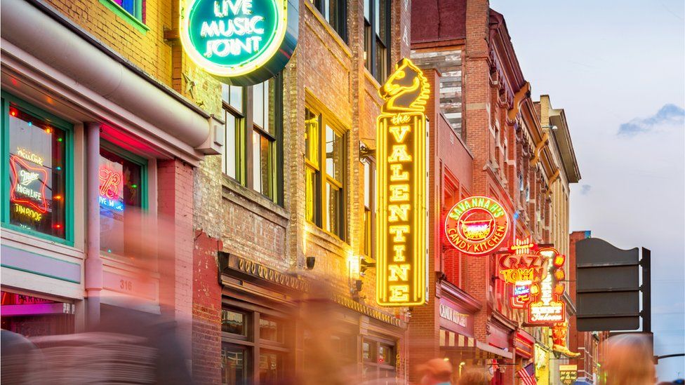 Broadway pub district in downtown Nashville, Tennessee, USA, illuminated at twilight blue hour