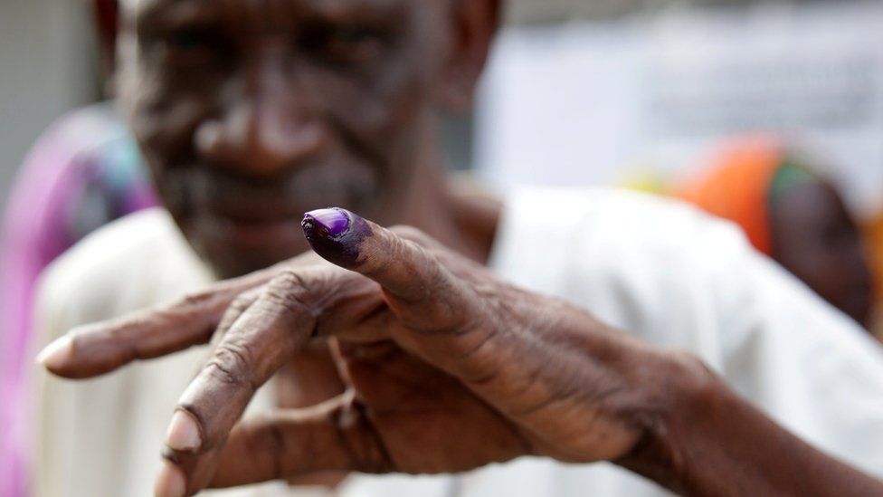 Voter displays his inked finger after casting a ballot during the presidential and parliamentary elections at the Ukombozi primary school in Dar es Salaam, Tanzania October 28, 2020.
