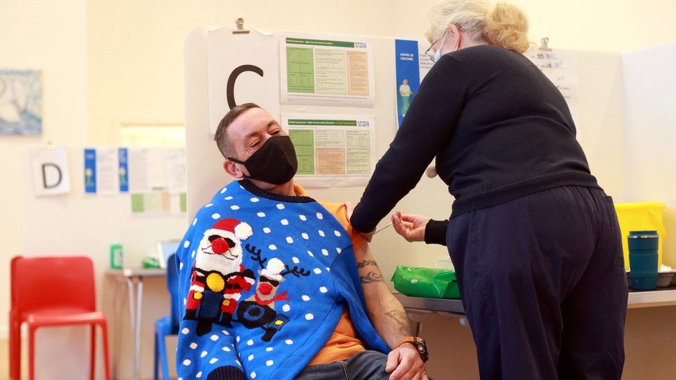 A man receives a Covid vaccine at the Sovereign Harbour Community Centre on Christmas Day in Eastbourne