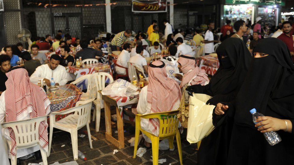 Saudis eat at an outdoors restaurant the Saudi Red Sea port of Jeddah in the early hours of August 26, 2011