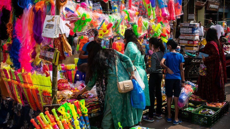 Street vendor selling Pichkari (Water gun) and other Holi celebration items at a market, ahead of Holi Festival in Guwahati, Assam, India on 6 March 2023. Holi is a celebration of the divine love between Lord Krishna and Radha and the victory of good over evil.