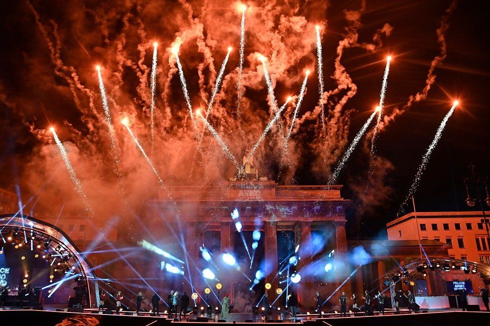 Fireworks explode over Berlin's landmark Brandenburg Gate to usher in the new year during a concert 'Willkommen 2021' (Welcome 2021)
