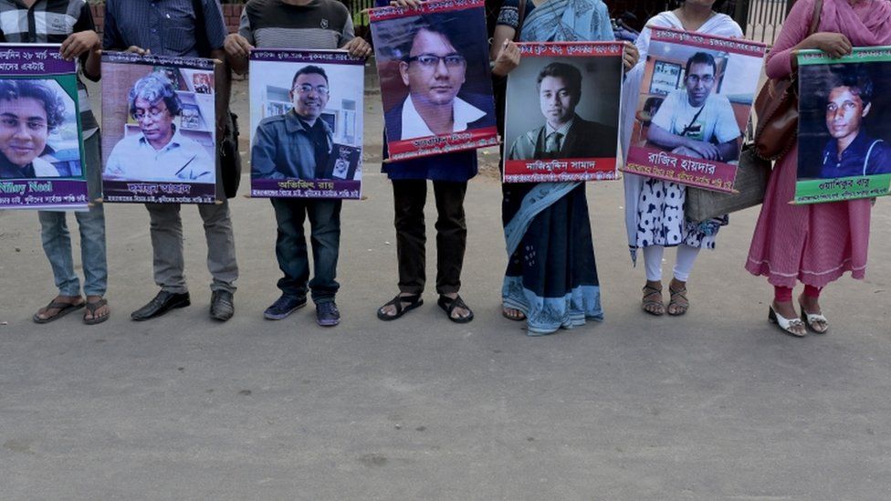 Bangladeshi activists hold portraits from left of, Niloy Nill, Humayun Azad, Avijit Roy, Arefin Dipon, Nazimuddin Samad, Rajib Haydar, Wasiqur Babu who are among those killed in the last few years.