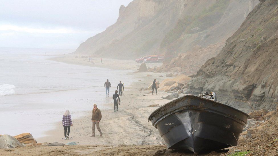 A panga boat sits along the Black's Beach, after two panga fishing boats capsized off the coast of San Diego, following an apparent migrant smuggling operation according to emergency officials, in San Diego, California
