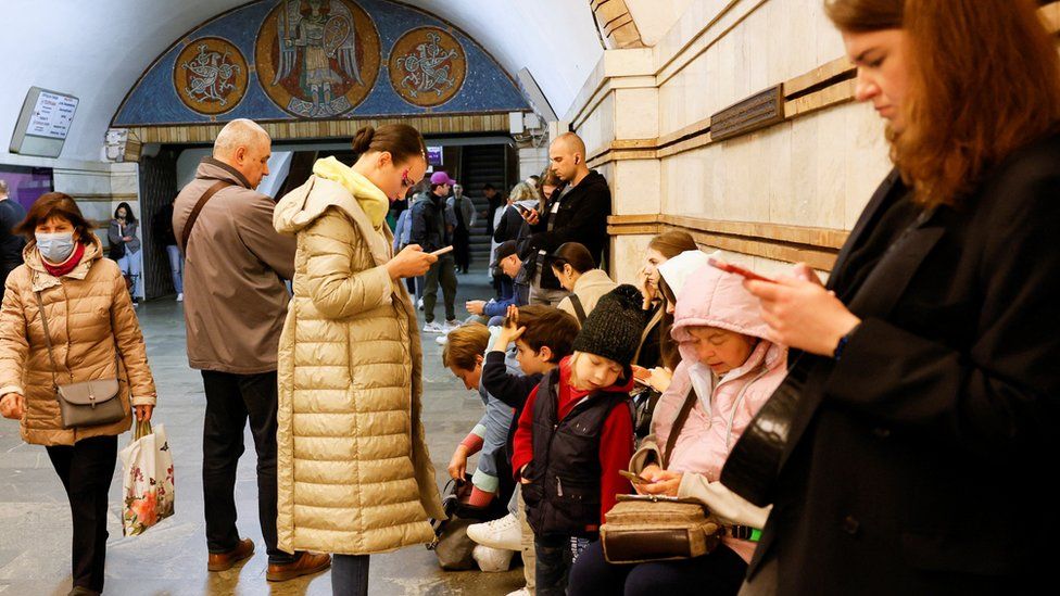 People take shelter in a Kyiv metro station during an air raid alert on 5 May 2023