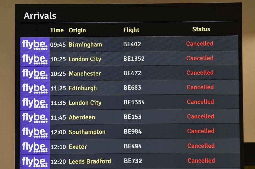A screen showing cancelled flight departures from Belfast City Airport