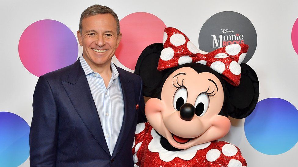 Disney chief executive Bob Iger and Minnie Moutilize.