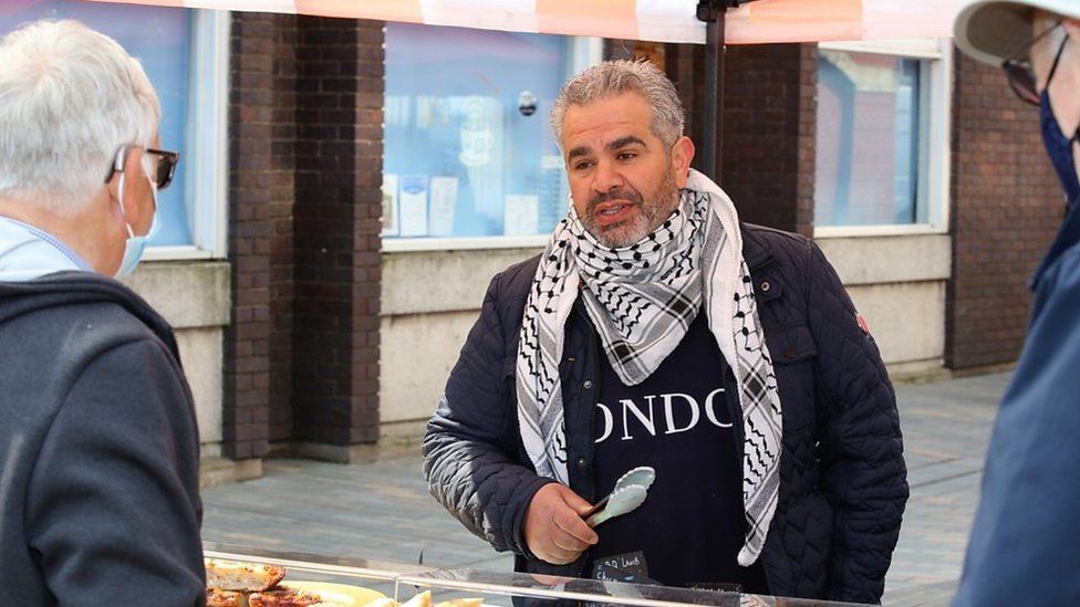 Tuck in: Customer being served with Lebanes food at Mold market in Flintshire