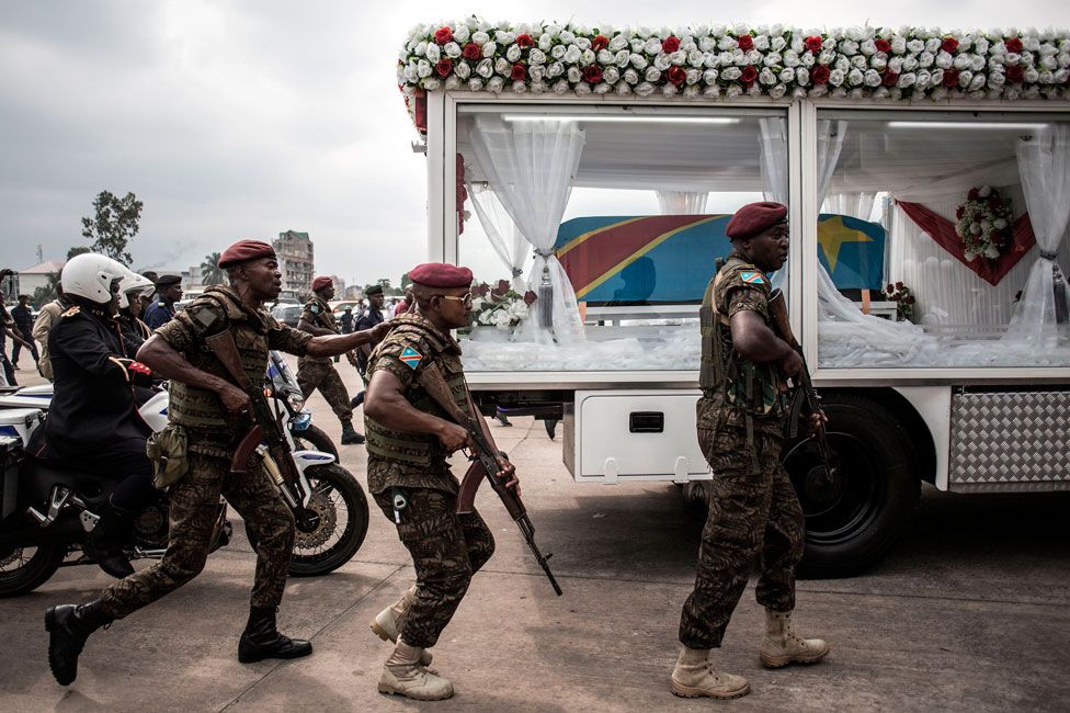 Government forces escort a hearse carrying the coffin of former DR Congo Prime Minister and opposition leader Etienne Tshiseked