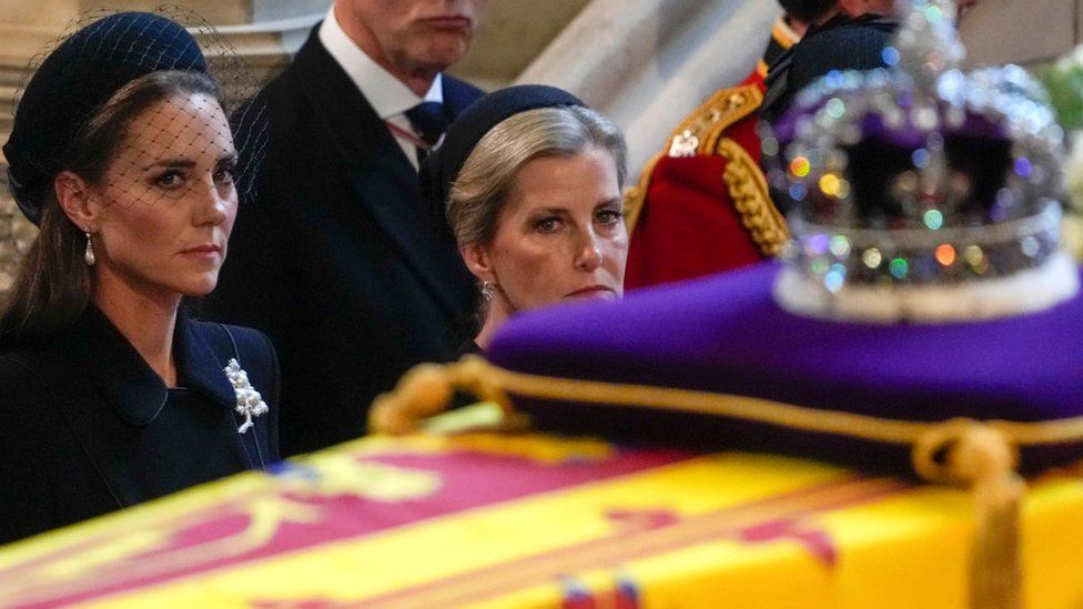 The Princess of Wales and Sophie, Countess of Wessex, look at the Queen's coffin