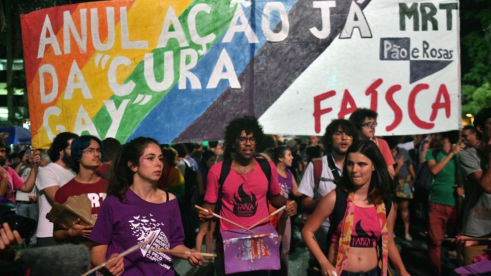People protest against a Brazilian judge's decision to approve conversion therapy