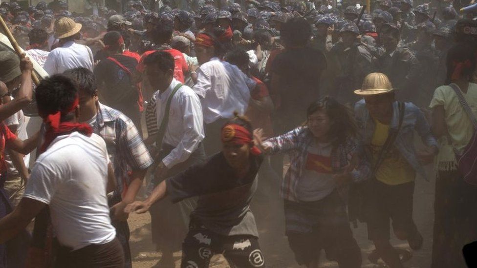 In this March 10, 2015 file photo, student protesters run as police officers charge them during a crackdown in Letpadan, 140 kilometres (90 miles) north of Yangon, Myanmar.