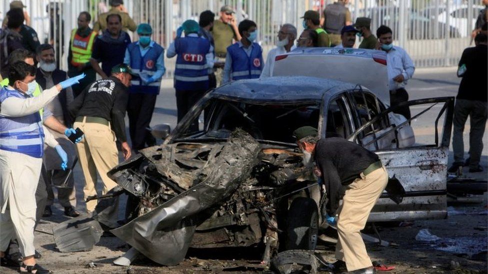 A policeman collects evidence from the crime scene after a suicide blast in Lahore, Pakistan July 24, 2017.