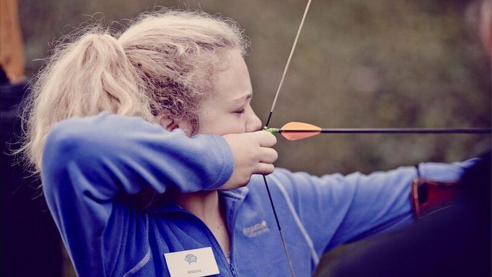 Girl firing arrow