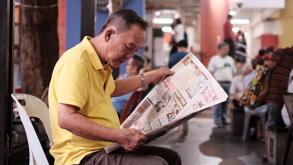 reading newspaper