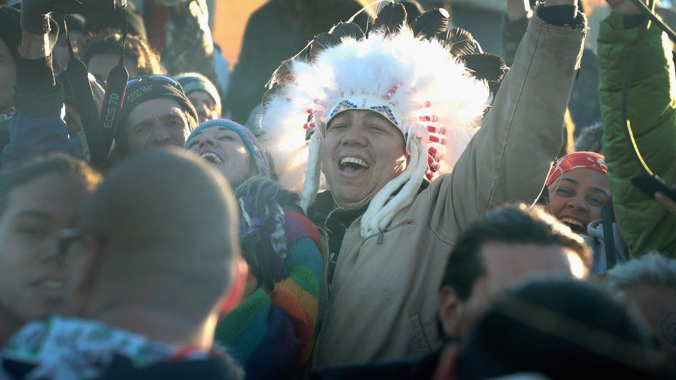 Native American and other activists celebrate after learning an easement had been denied for the Dakota Access Pipeline at Oceti Sakowin Camp on the edge of the Standing Rock Sioux Reservation on December 4, 2016 outside Cannon Ball, North Dakota. The US Army Corps of Engineers announced today that it will not grant an easement to the Dakota Access Pipeline to cross under a lake on the Sioux Tribes Standing Rock reservation, ending a months-long standoff.