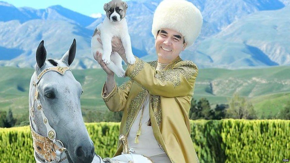 Turkmen leader on horseback holding a puppy