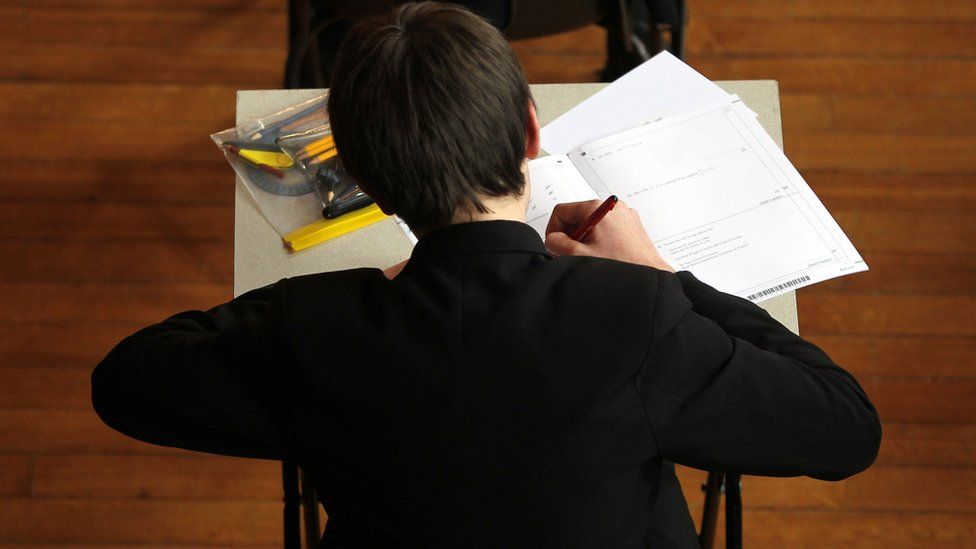 School boy taking an exam