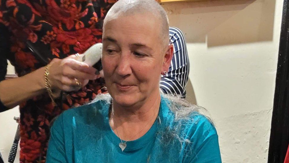 Jo Bunce having her head shaved