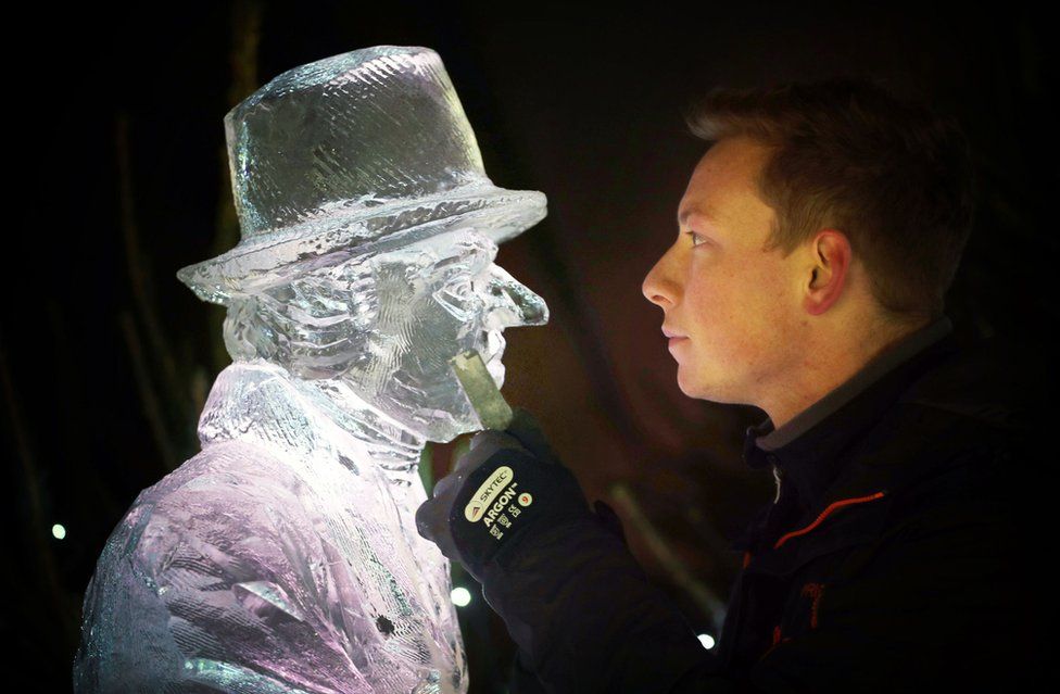 Master ice sculptor Jack Hackney puts the finishing touches to an ice sculpture.