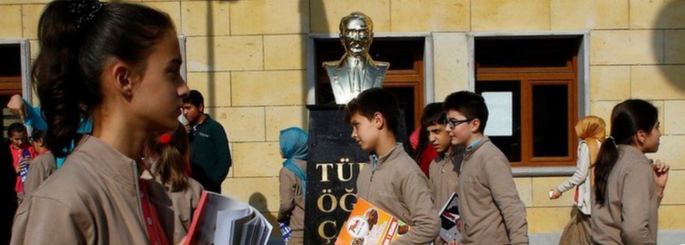 Students in Ankara walk past a statue of Kemal Ataturk (file pic)