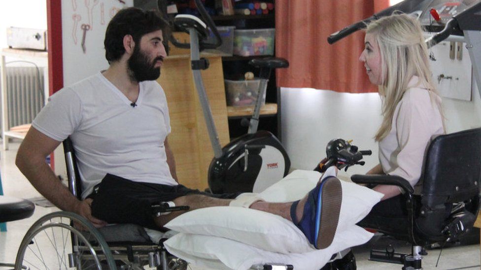 Injured Syrian (left) with Nikki Fox