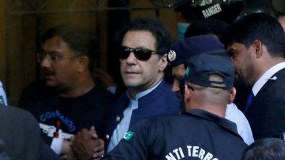 Security officers escort Pakistani former Prime Minister Khan, Imran as he appeared in Islamabad High Court, Islamabad, Pakistan, May 12, 2023