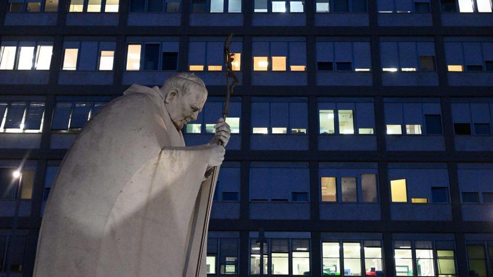 A statue of late Pope John Paul II in front of the Gemelli hospital in Rome