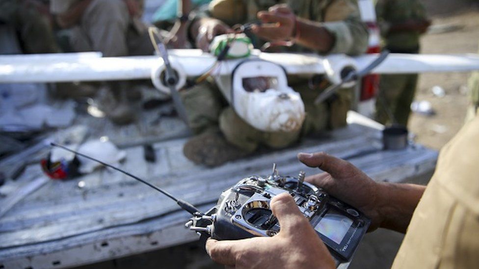 Peshmerga forces assemble an unmanned aerial vehicle (UAV)