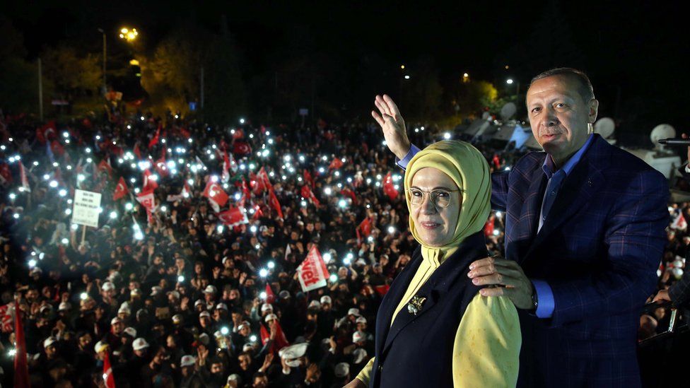 Turkish President Recep Tayyip Erdogan (R) and with his wife Emine (L) waving to supporters during a rally in front of the residence in Istanbul, Turkey, 16 April 2017