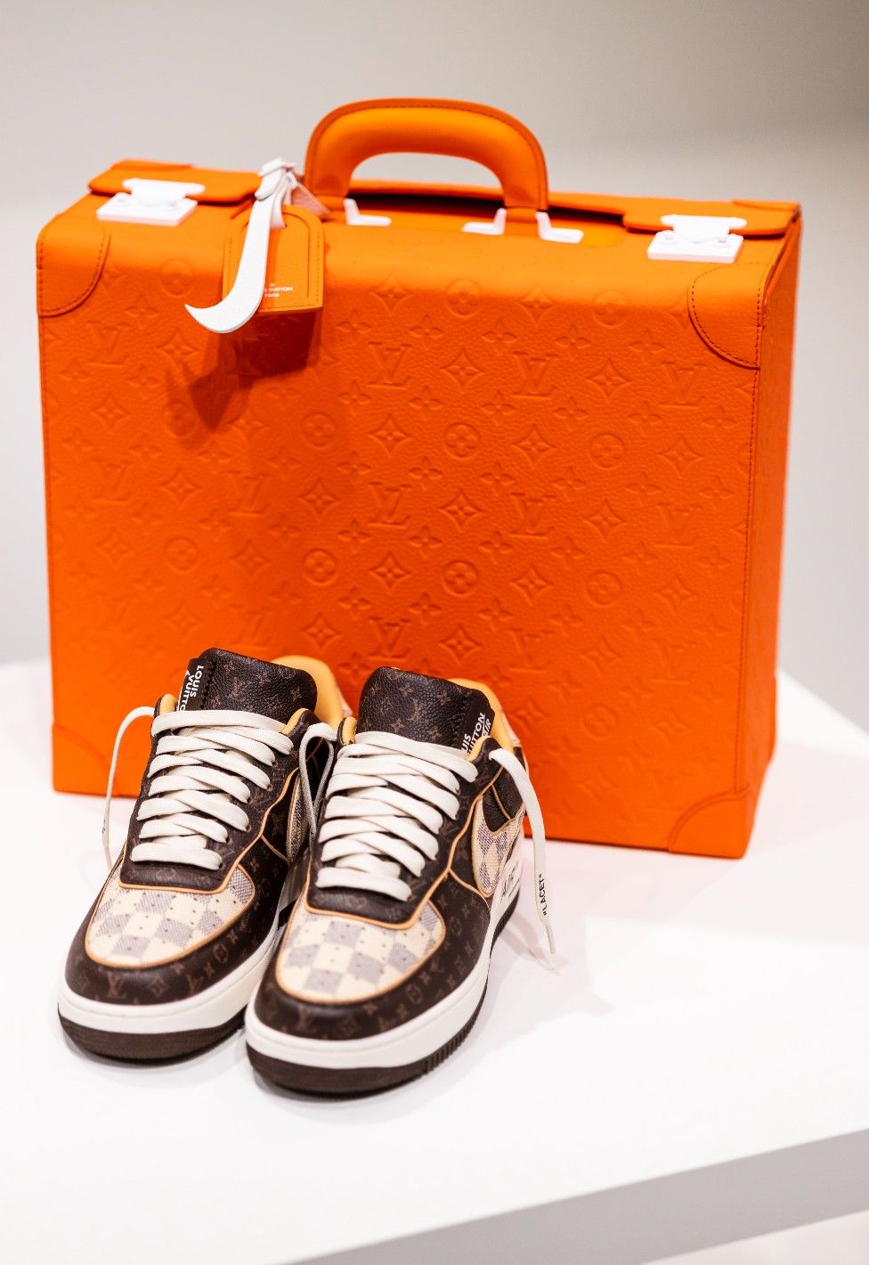 A pair of limited edition Louis Vuitton Nike Air Force 1 sneakers, created by the late US designer Virgil Abloh
