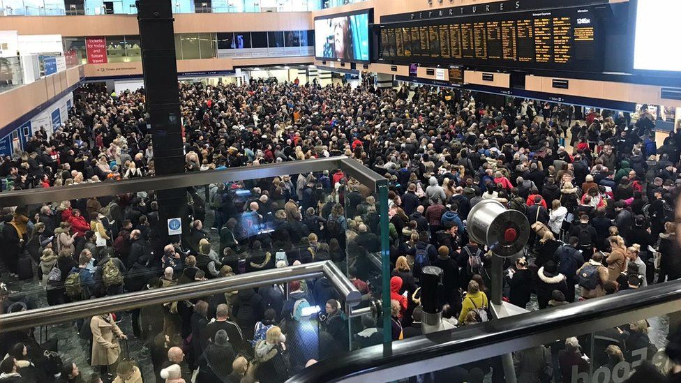 Huge crowds at London Euston by the departure boards